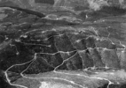 Aerial View – Clearcuts and logging roads outside impact area- approx. 20 miles W. of Mt. St. Helens, Wash., 1982